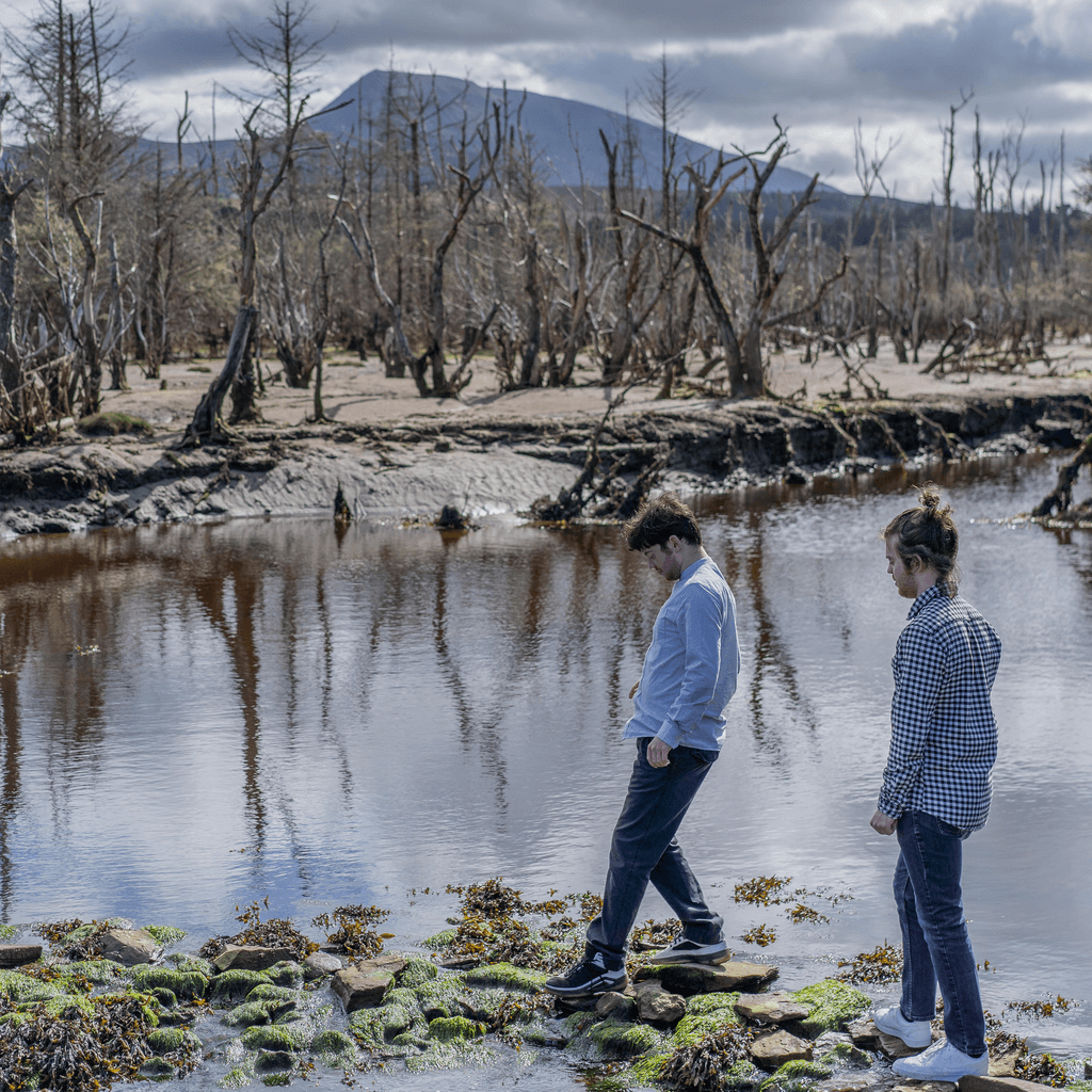 Murray Brothers walking alongside a river